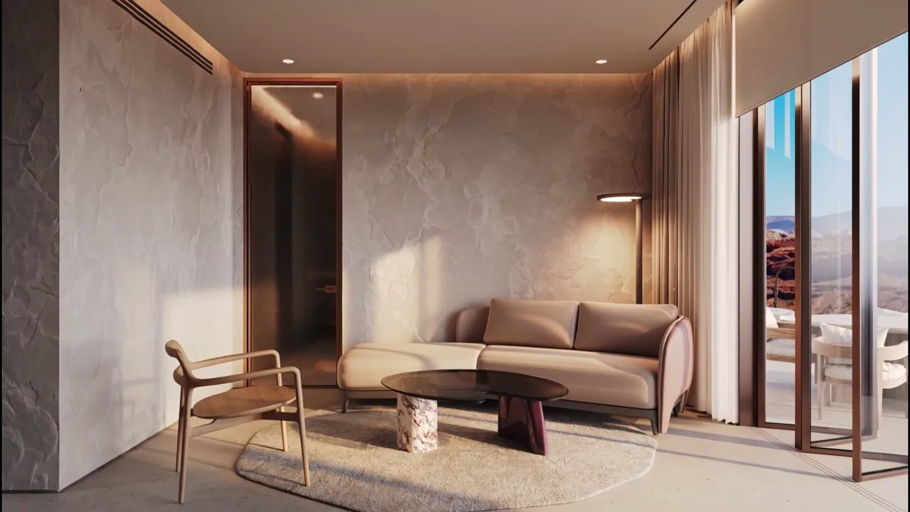 Suite interior opening to a desert horizon, stone and warm timber surfaces